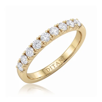 Gold ring with a row of round-cut diamonds set along the band, engraved inside with 'DITANI'