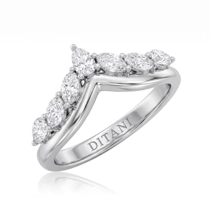 Diamond-studded ring with oval/marquise-cut stones set along a curved band in white gold; engraving reads DITANI on the inner band