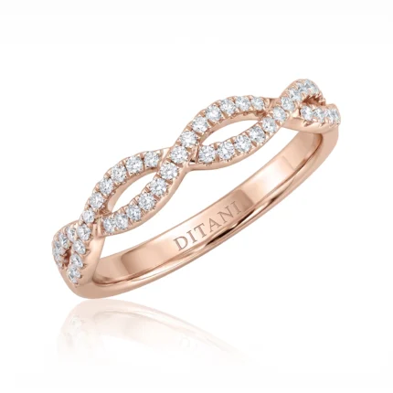 Rose gold ring with two diamond-encrusted intertwined infinity loops.