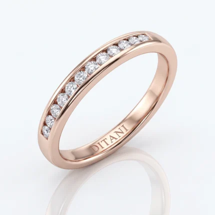 Rose gold band with a channel of diamonds along the top, engraved 'DITANI' inside