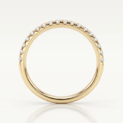 Gold ring with a row of small diamonds along the top half of the band, photographed against a pale background.
