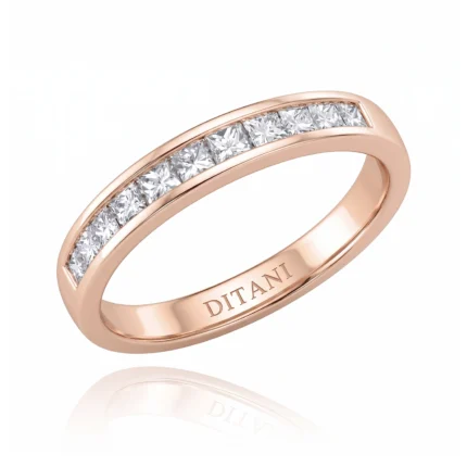 Rose gold ring with a row of square-cut diamonds set in a channel along the top of the band, inner engraving reads DITANI.