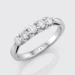 Five-diamond ring in white metal with five round diamonds set in a row and a polished band (inscription inside reads DITANI).