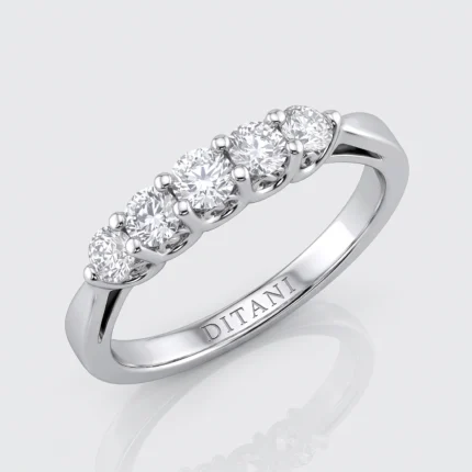 Five-diamond ring in white metal with five round diamonds set in a row and a polished band (inscription inside reads DITANI).