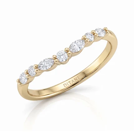 Gold ring with a row of alternating diamonds separated by tiny gold beads along the band (yellow gold). Used as an elegant eternity-style design piece.