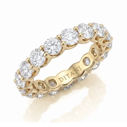 Yellow gold diamond eternity ring with round-cut stones all around; inner engraving reads 'DITANI'.