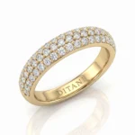 Gold ring with multiple diamond pavé rows and a polished inner band engraved 'DITANI'