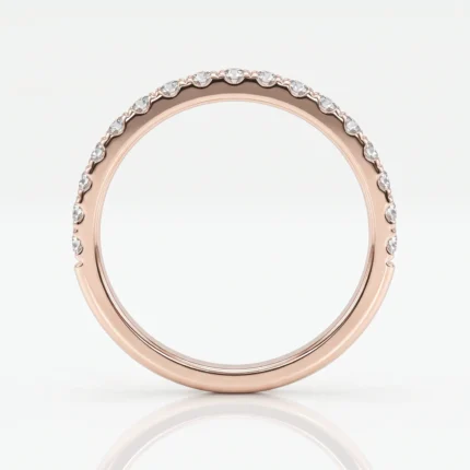 Rose gold ring with diamonds set along the outer/top edge of the band.