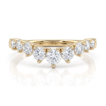 Gold ring featuring a row of round diamonds arranged in a curved cluster along the band with a central drop-like arc of stones.