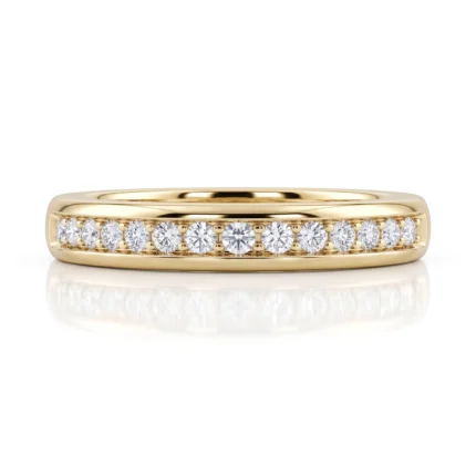 Yellow gold band ring with a row of round-cut diamonds set along the top edge, sparkling and evenly spaced.