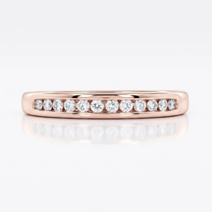 Rose gold diamond band with a row of diamonds set in a channel along the top edge of the ring