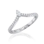 Diamond engagement ring with a marquise-cut center stone and pavé diamonds along the band (DITANI inside).