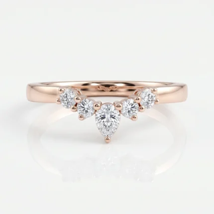 Rose gold ring with a pear-shaped central diamond and surrounding smaller diamonds in a curved row