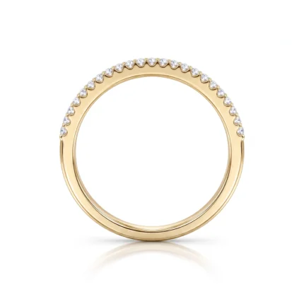 Gold ring with a row of small diamonds along the top edge of the band, on a white background