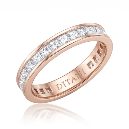 Rose gold ring with a row of princess-cut diamonds set in a channel along the top surface.