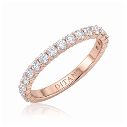 Rose gold ring with a row of diamonds set along the band, engraved DITANI on the inner side.