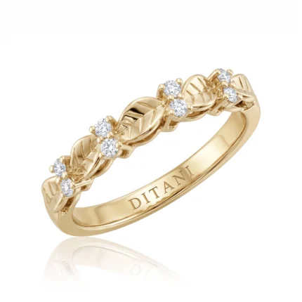 Gold ring with a twisted leaf-like design and small diamonds set along the band, inner engraving reads DITANI