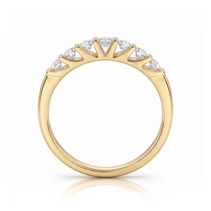 Gold ring with a row of diamonds along the top in a crown-like setting.