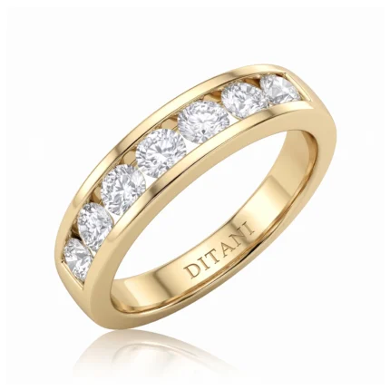 Gold ring with a row of diamonds set along the band, inner engraving reads DITANI (jewelry brand) — elegant, classic design.