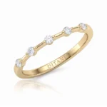 Gold ring with five round diamonds set along the band and DITANI engraved inside.