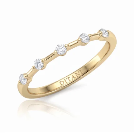Gold ring with five round diamonds set along the band and DITANI engraved inside.