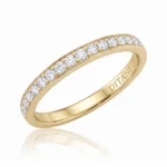 Gold ring with a row of diamonds along the top edge and 'DITANI' engraved on the inner band.