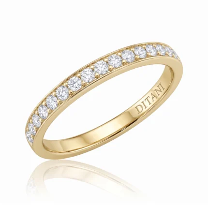 Gold ring with a row of diamonds along the top edge and 'DITANI' engraved on the inner band.