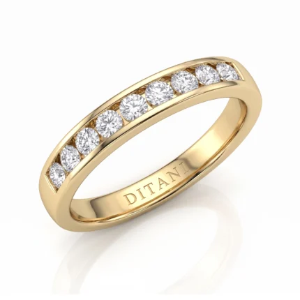 Gold ring with a row of seven diamonds set along the top in a channel, inner engraving reads DITANI/DITA NI.