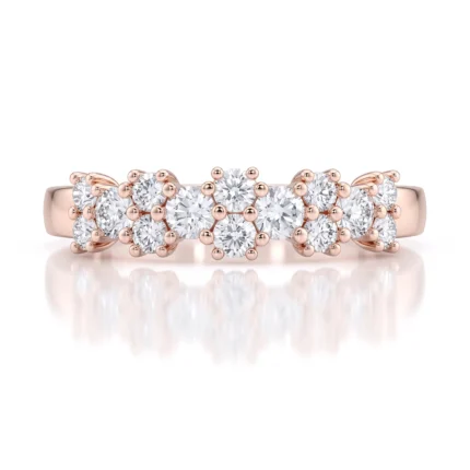 Rose gold ring with five clusters of round diamonds set in prongs along the band, creating a sparkling row of stones.