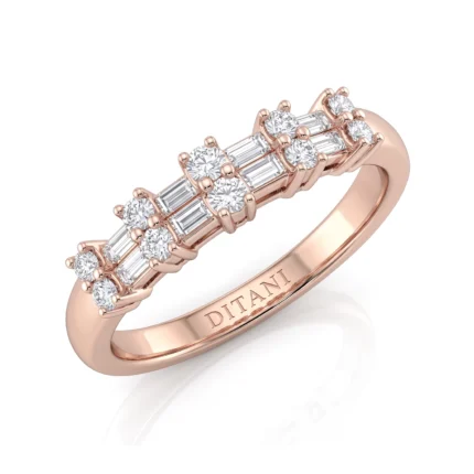 Rose gold ring with alternating round and baguette diamonds along the top of the band, inner engraving 'DITANI' visible