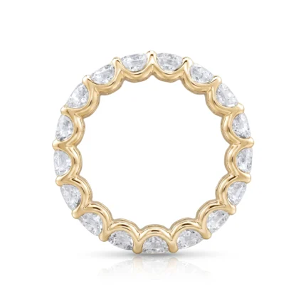 Gold ring with a continuous row of alternating diamond marquise-cut stones set in a wavy bezel design around the band (eternity style).