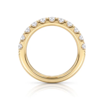 Gold ring with a row of diamonds along the top half, set in yellow gold.