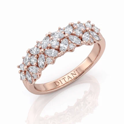 Rose gold ring with a cluster of diamonds arranged in leaf-like shapes along the band.