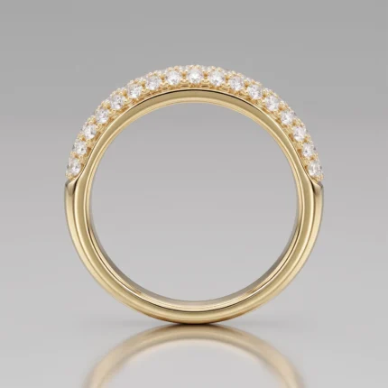 Gold band ring featuring a curved row of sparkling diamonds along the top edge, close-up view