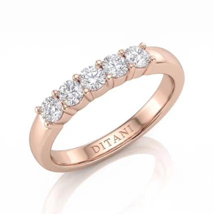 Rose gold ring with five round diamonds in a row and 'DITANI' engraved on the inner band