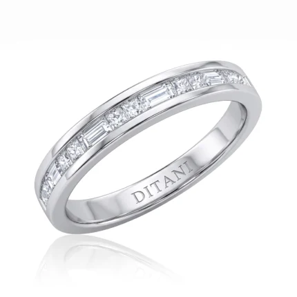 White metal ring with a channel of square-cut diamonds around the band, inscribed 'DITANI' on the inner surface.
