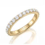 Gold ring with a row of round diamonds along the band and 'DITANI' engraved inside the inner side of the band