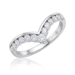 Silver ring with a curved band forming a heart-shaped negative space and pavé diamonds along the band.