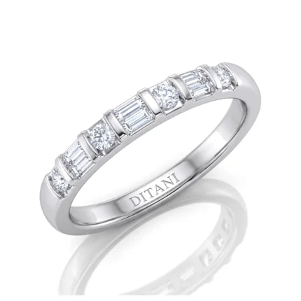 Silver ring with alternating round and baguette diamonds along the band, inner engraving reads DITANI