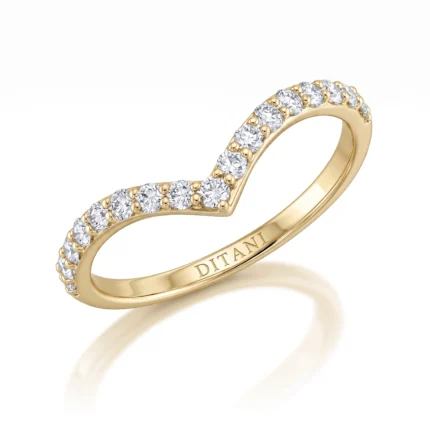 Gold ring in yellow gold with a curved row of diamonds along the arc and 'DITANI' engraved on the inner band