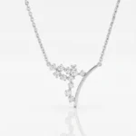 Silver necklace with a curved bar pendant set with small diamonds in a floral cluster design.