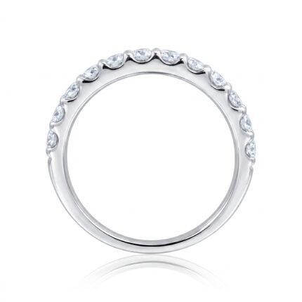 Close-up of a silver ring with alternating diamond stones set along a curved edge, against a white background with reflection beneath.