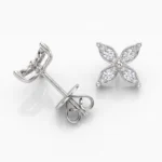 Silver, flower-shaped diamond stud earrings with four petal-like petals and a butterfly backing.