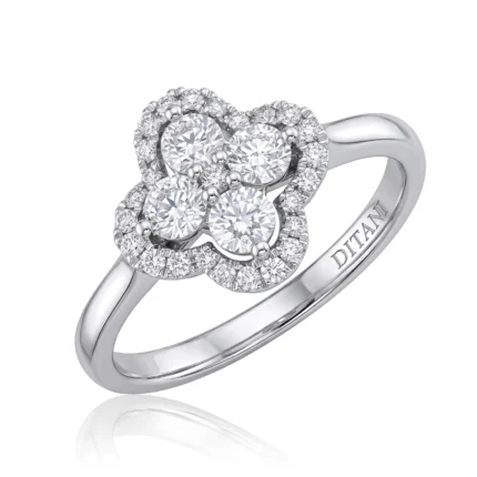 Silver halo diamond ring featuring four central stones surrounded by a pavé-set halo of smaller diamonds on a polished band (DITANI engraved inside).