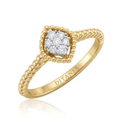 Gold ring in yellow gold with a beaded halo surrounding a cluster of diamonds and a twisted rope band; inside, the engraving DITANI is visible.