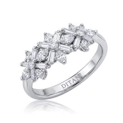 Silver diamond ring with a cluster of round and baguette stones, engraved Ditani on the inner band.
