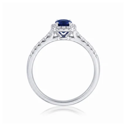 Silver ring with an oval blue sapphire centerpiece surrounded by a diamond halo on a polished band.