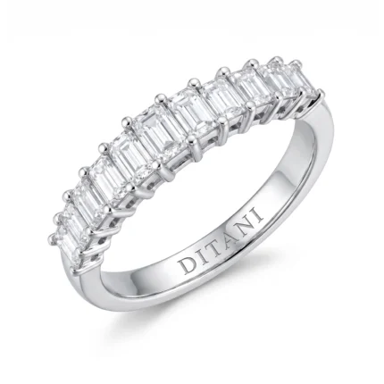 Silver ring with a row of baguette-cut diamonds and a polished inner band (engraved DITA).