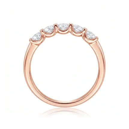 Rose gold ring with five sparkling diamonds set along a waved top band
