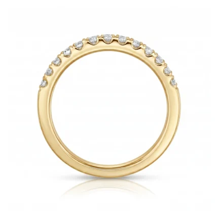 Gold ring with a row of small diamonds along the top arc, set in a polished band.
